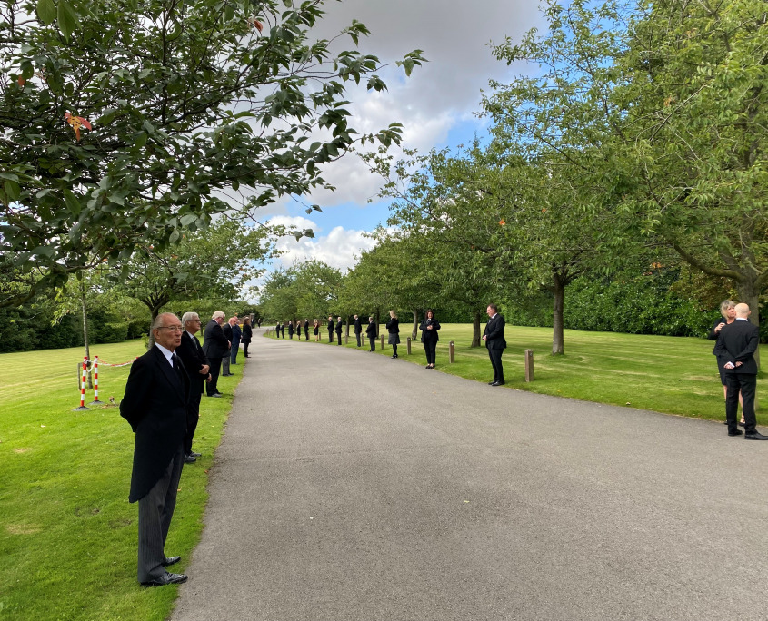 David's colleagues forming a guard of honour at his funeral.